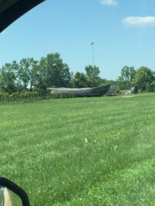 Decommissioned Santa Maria ship replica hull sitting in a grassy field