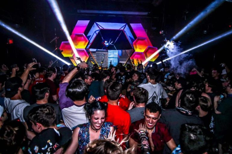 Columbus Bars To Hit Up When You Want To Get Weird And Rage 3 Crowded dance floor at Skully's under colorful hexagonal stage lights and fog