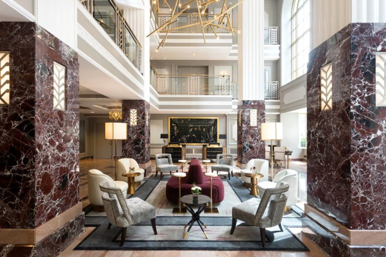 This Century-Old, Art Deco Tower Is The Most Iconic Building In Columbus 15 Grand lobby at Hotel LeVeque with marble columns and multi-story atrium