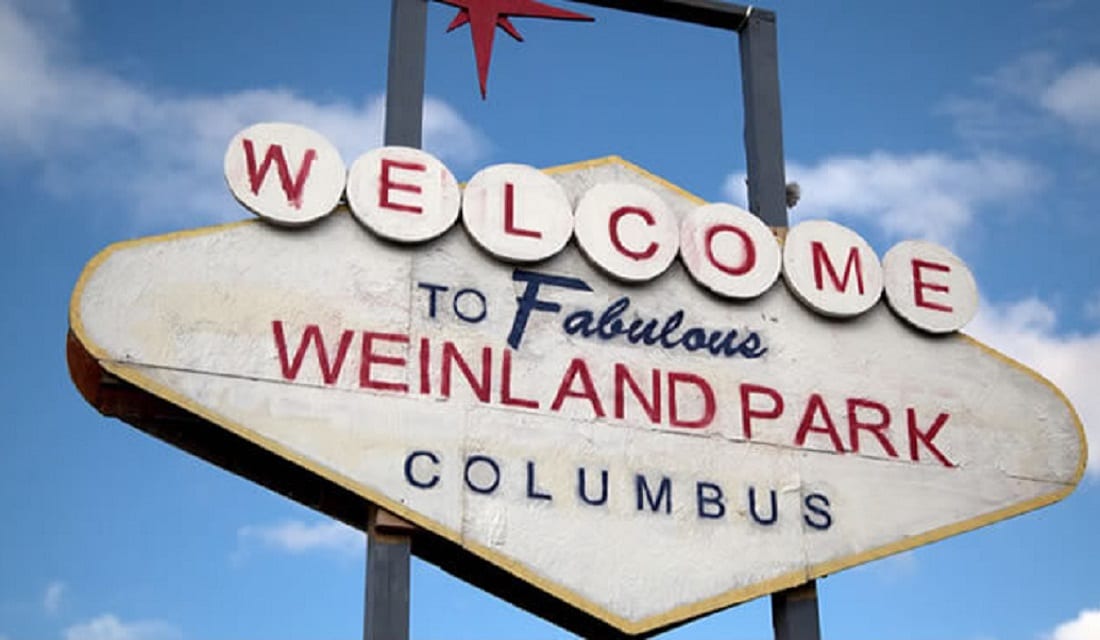 The 10 Hottest Neighborhoods For Young Adults In Columbus Welcome to Weinland Park sign styled after the Las Vegas sign