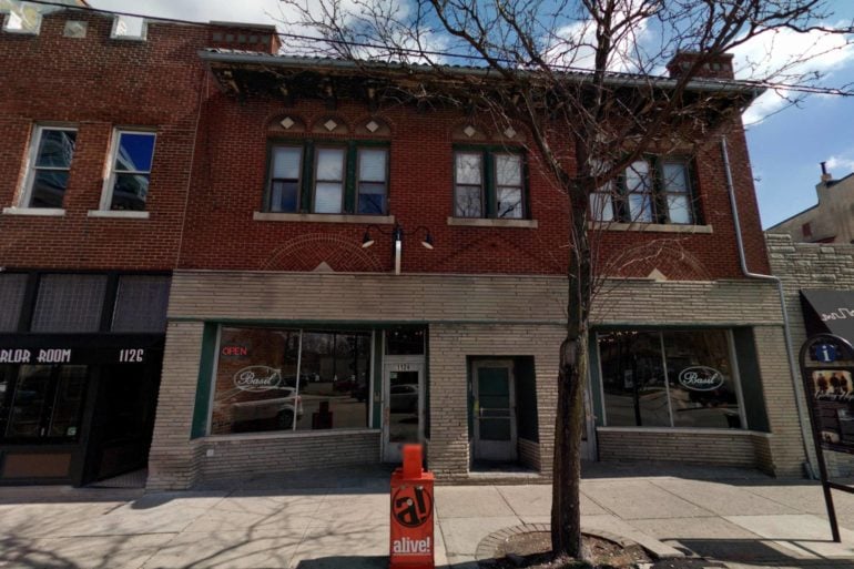 This Nashville-Inspired Short North Bar Will Feature Country Music, Barbecue, And A Massive Whiskey & Bourbon Selection 5 Historic brick building with street-level storefronts and bare tree in foreground.