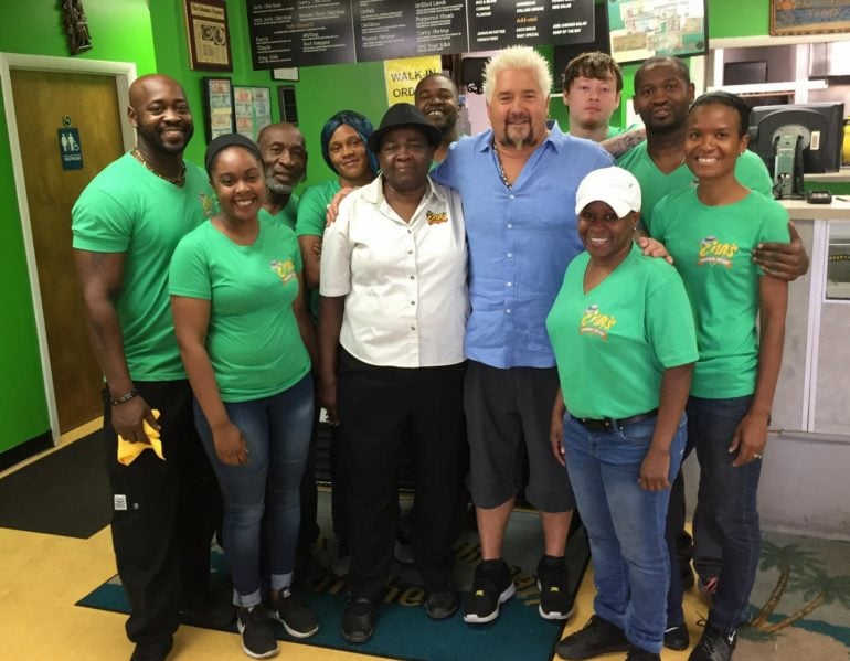 Diners, Drive-Ins & Dives: Every Columbus Restaurant On DDD 11 Guy Fieri poses with the staff of Ena's Caribbean Kitchen inside the restaurant