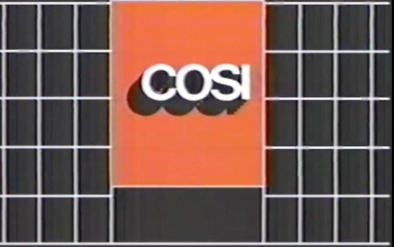 10 Nostalgic Columbus Commercials That Will Transport You Back In Time 3 COSI logo displayed on orange banner with dark grid background.