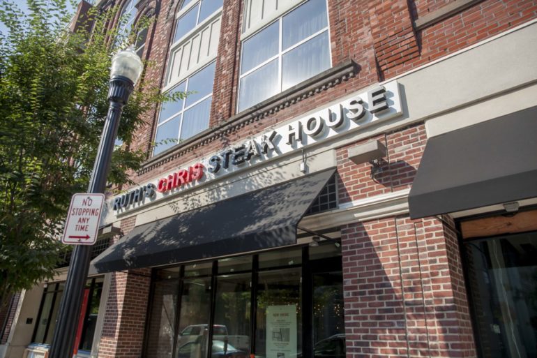 Ruth's Chris Steak House Is Back In Columbus And Looking Better Than Ever 2 Storefront of Ruth's Chris Steak House restaurant with brick building facade and black awning.