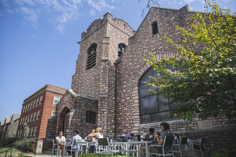 8 Best Study Spots In Columbus That Aren’t Your Living Room 2 Stone church building housing Stauf's Coffee Roasters with outdoor seating on Neil Avenue