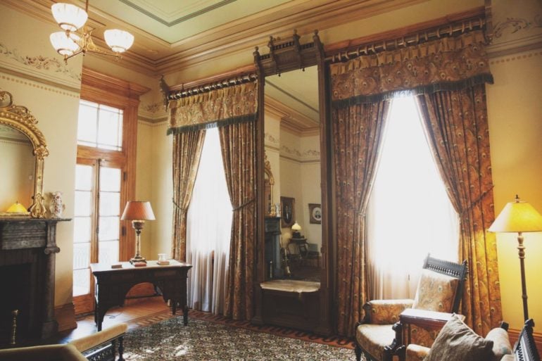 7 Free Museums You Should Definitely Visit Around Ohio 3 Ornate Victorian-style room with patterned drapes, a gold mirror, and antique furniture