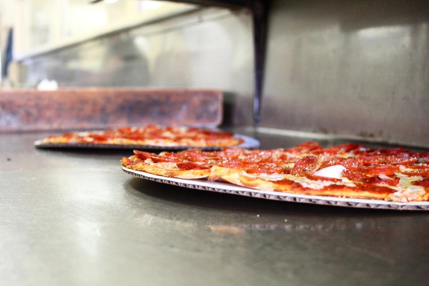 thin, columbus style pepperoni pizza on grill