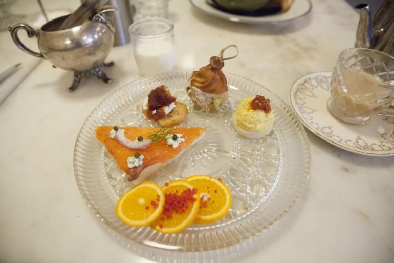 Get Fancy: It's Time For Afternoon Tea At Asterisk Supper Club 1 Afternoon tea plate with smoked salmon, deviled egg, and orange slices