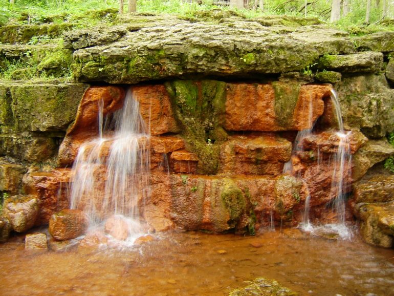 Take The Path Less Traveled At These Underrated Parks Around Ohio 5 Spring water cascading over iron-orange rock at Glen Helen Nature Preserve in Yellow Springs