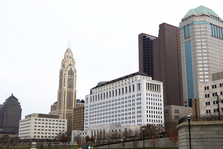 This Is How Much Space Parking Lots Take Up In Downtown Columbus 2 a gloomy sky over columbus skyline