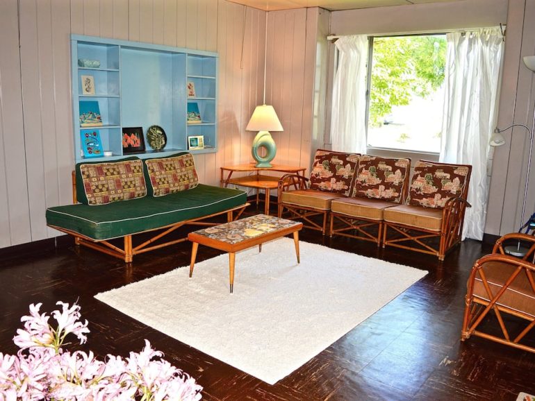 This Amazing Lustron Airbnb Is A Total Time Capsule 1 Retro living room with rattan furniture at the Lustron Airbnb