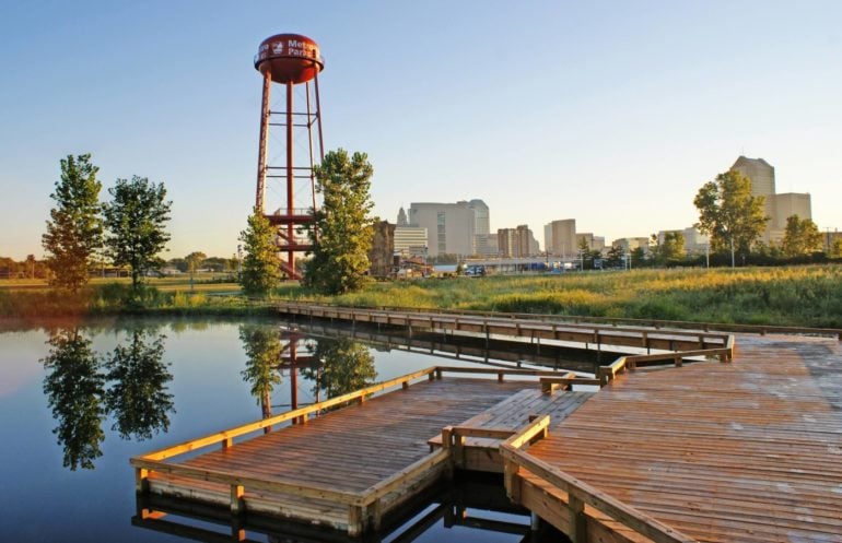 The 11 Best Things To Do At Scioto Audubon Metro Park 4 Water tower and wooden boardwalk at Scioto Audubon Metro Park with Columbus skyline
