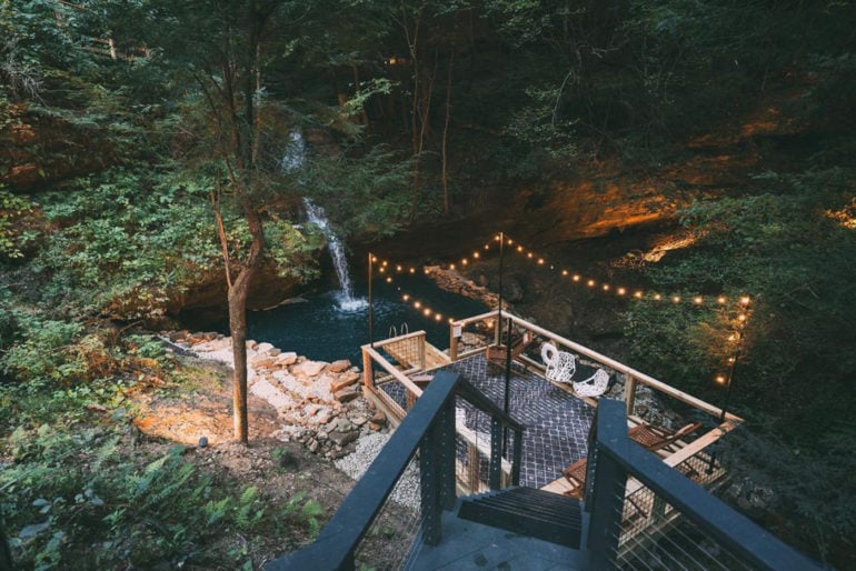 This Hocking Hills Lodge Has A Stunning, Heated Waterfall & Swimming Hole 3 The cliffs hocking hills