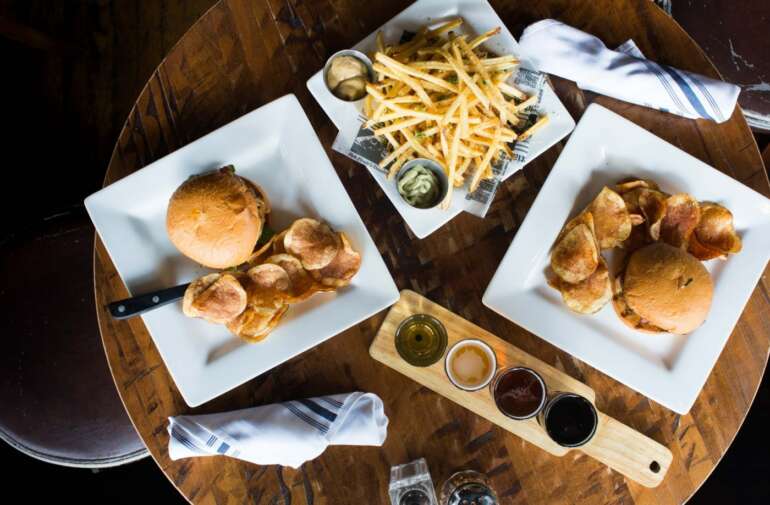 The Best Restaurants In The Short North 1 Burgers, chips, and fries with a beer flight at Arch City Tavern