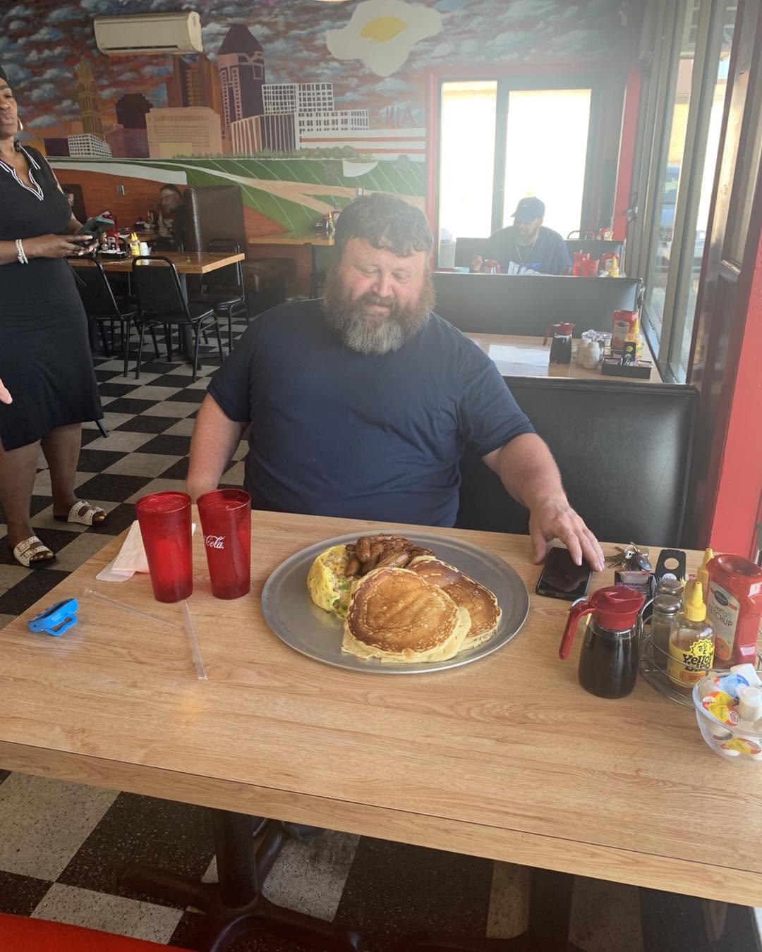 a kitchen sink challenge plate full of breakfast foods