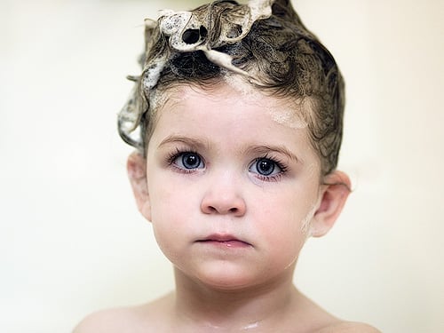 The Best Places To Go In Columbus For A Scalp Detox 14 Washing hair with shampoo at a sink