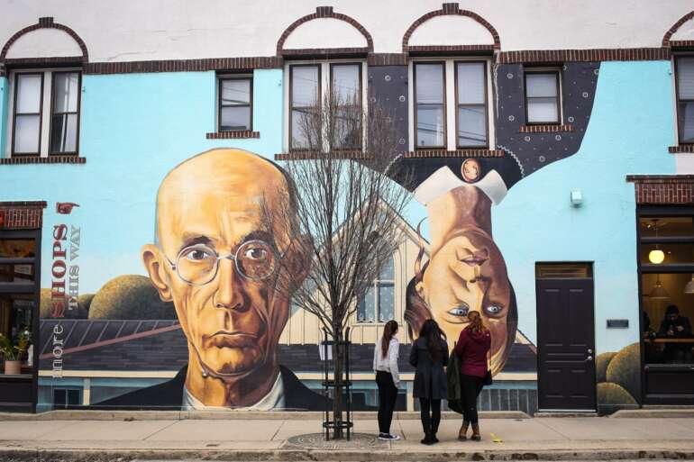People view the Short North Gothic mural in the Short North Arts District