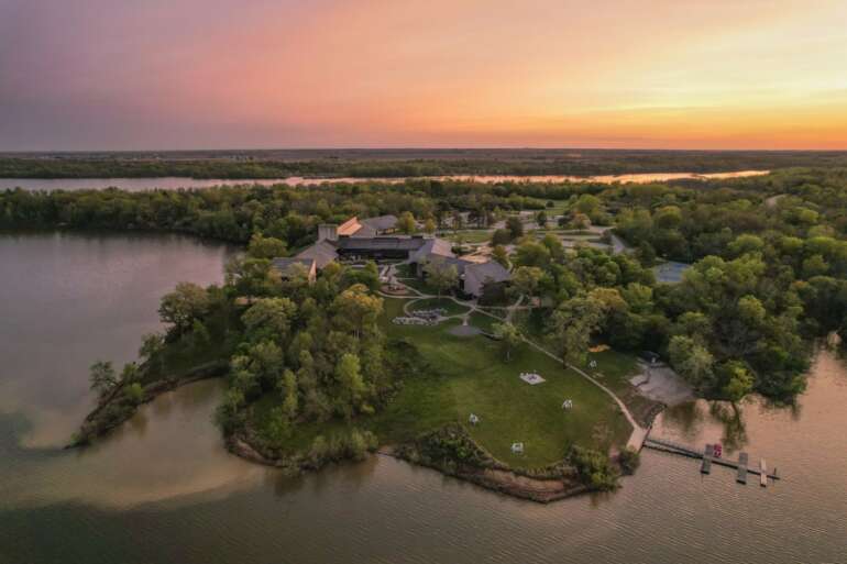 Aerial sunset view of the state park lodge on the lake shore