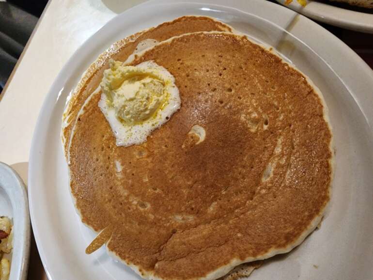 The 7 Best Places For Perfectly Delicious Pancakes In Columbus 3 Butter-topped pancake at Beechwold Diner, overhead view