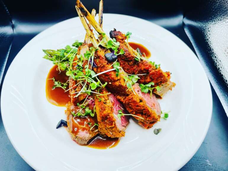 The Best Restaurants In And Around Hocking Hills 6 Plated rack of lamb with microgreens and sauce at Glenlaurel