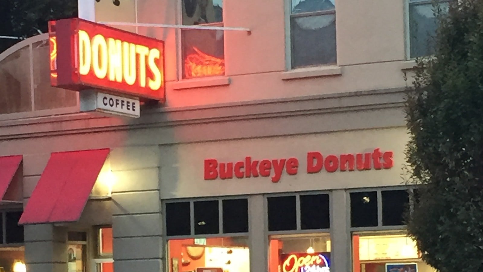 Buckeye Donuts storefront with its Donuts neon sign