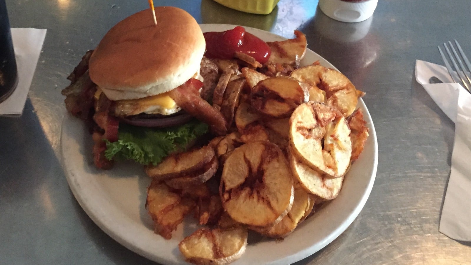 burger and fried potatoes at Press Grill