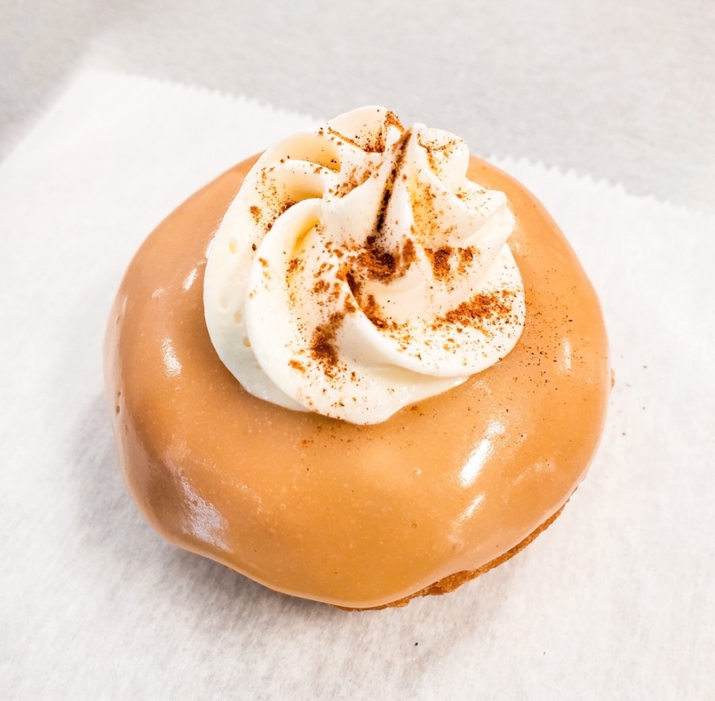donut topped with eggnog whipped cream