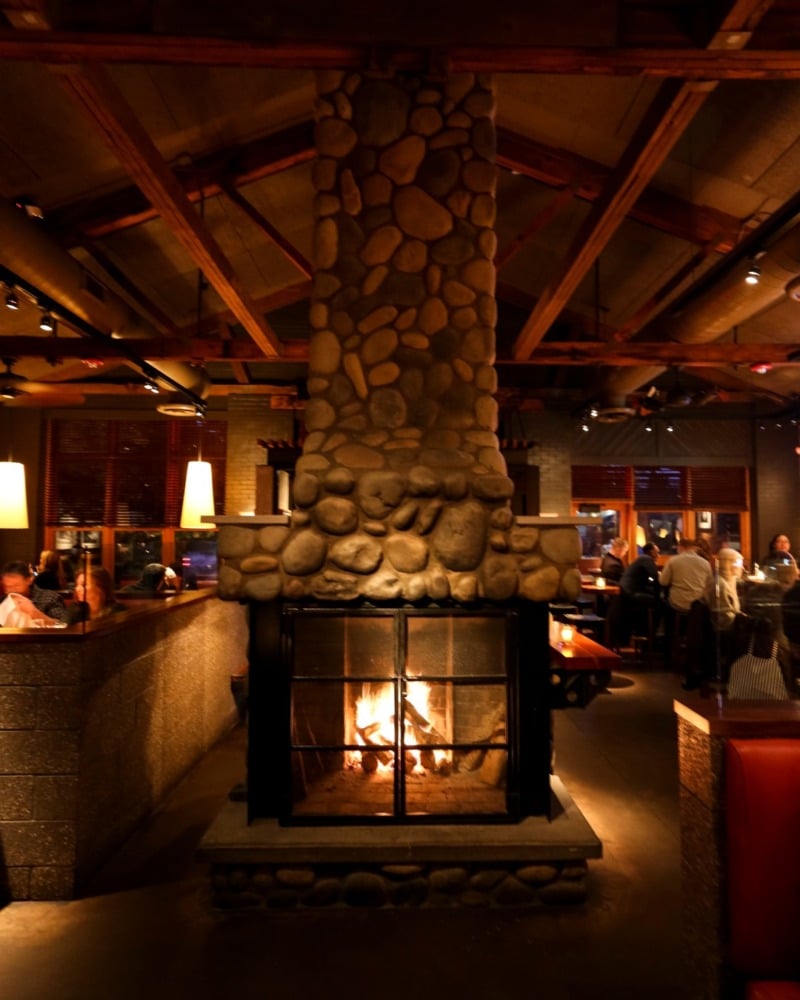 roaring stone fireplace in restaurant