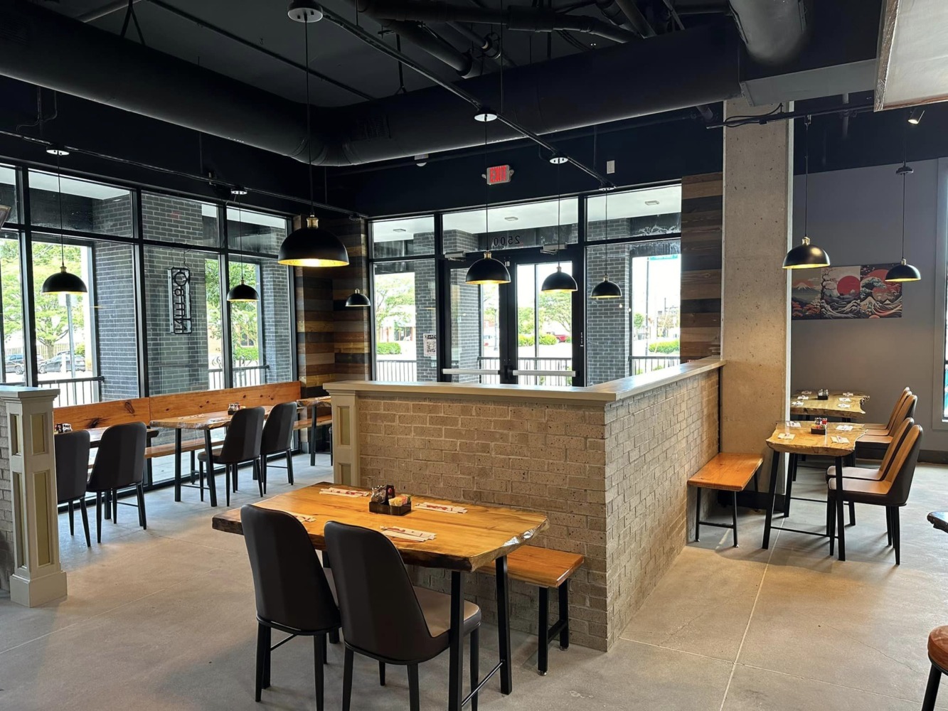 The 11 Best Ramen Shops In Columbus 5 Zundo Ramen and Donburi dining room on N High St with live-edge wood tables and a brick half wall