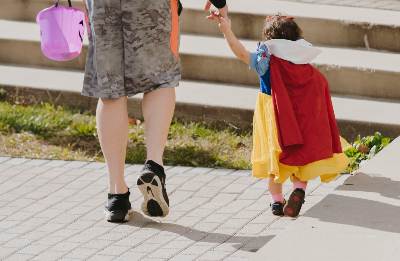 Trick Or Treat Has Been Moved Up For Some Central Ohio Communities child trick or treating with parent