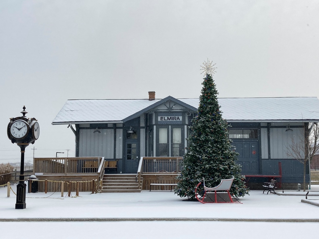 a snow covered vintage train station