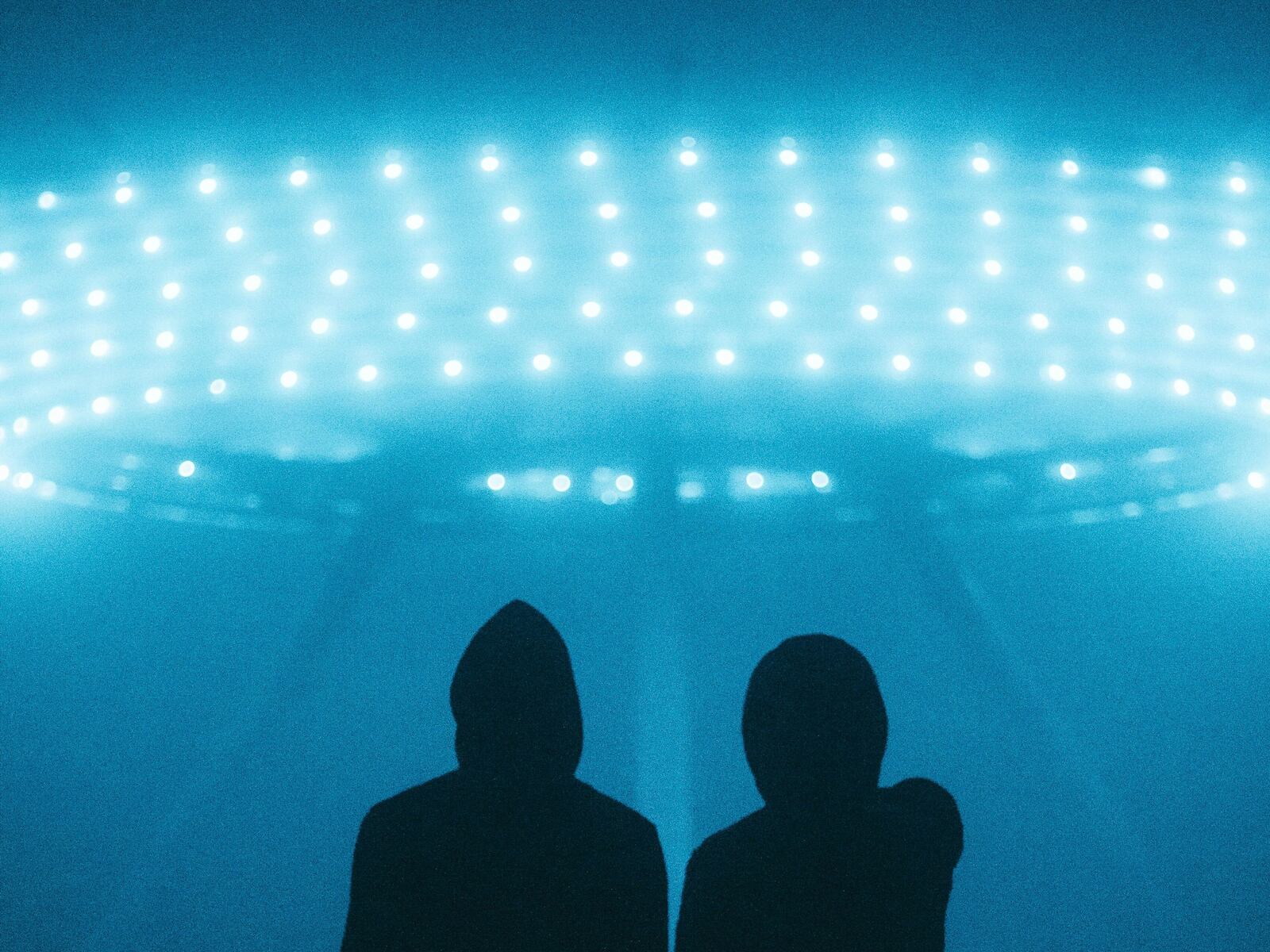 people standing in front of lights