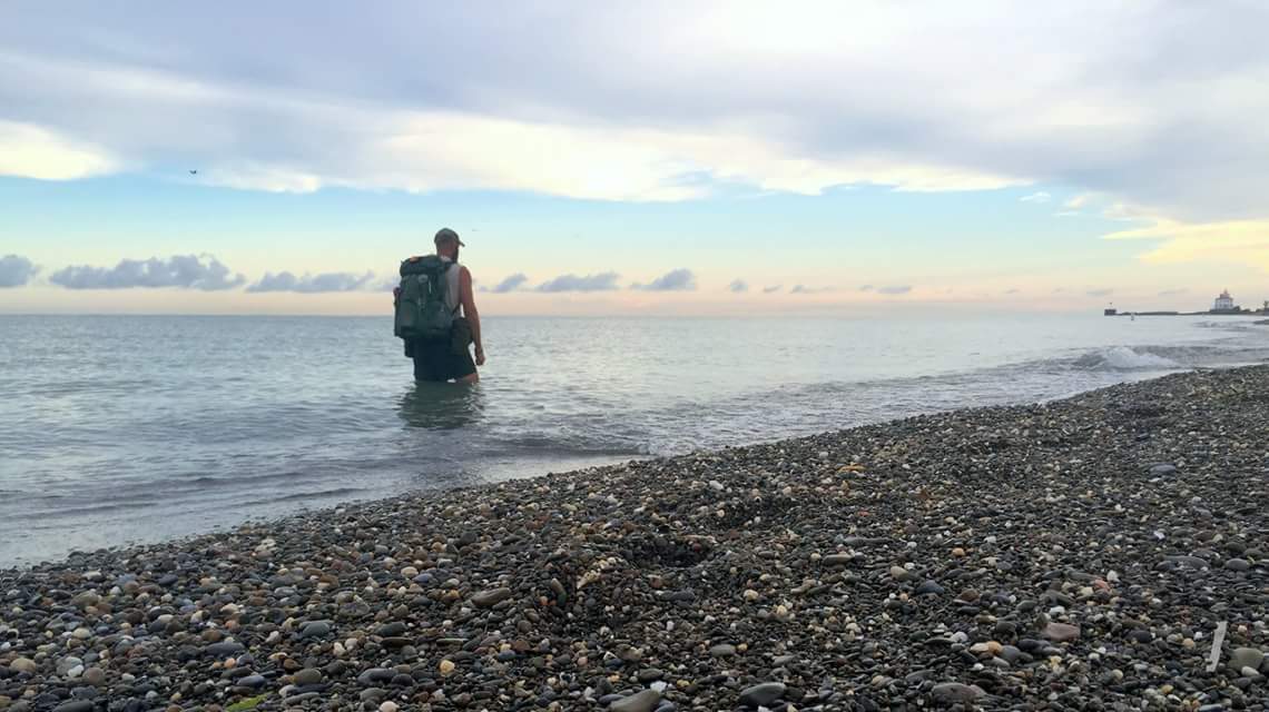 hiker standing in lake erie