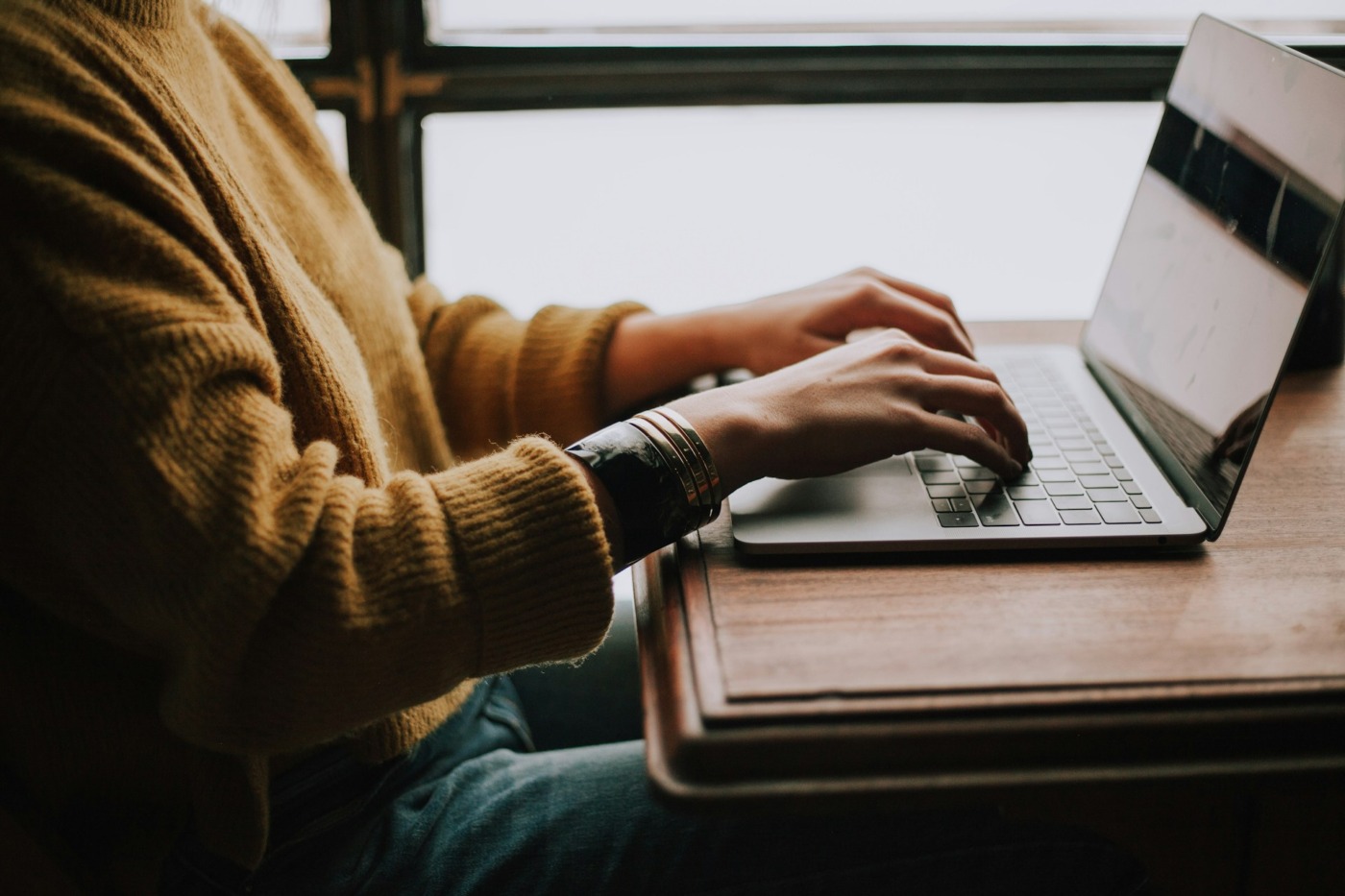 person typing on computer