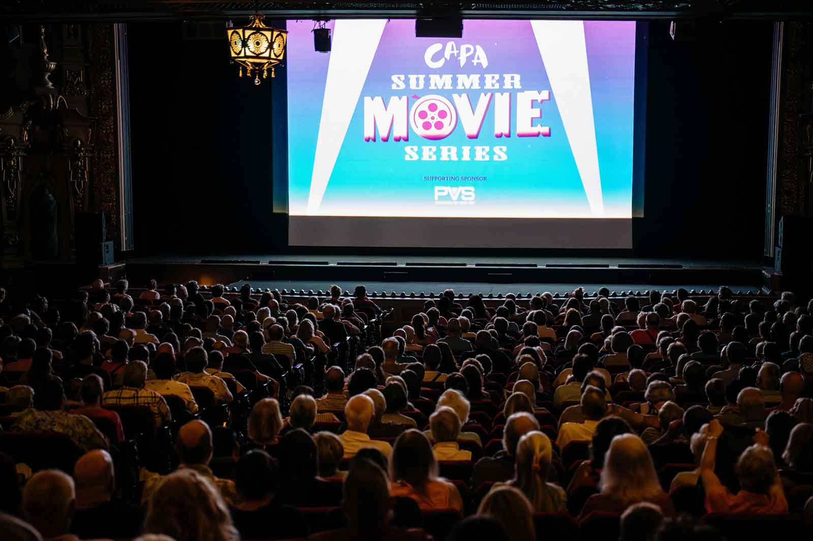movie screen with audience