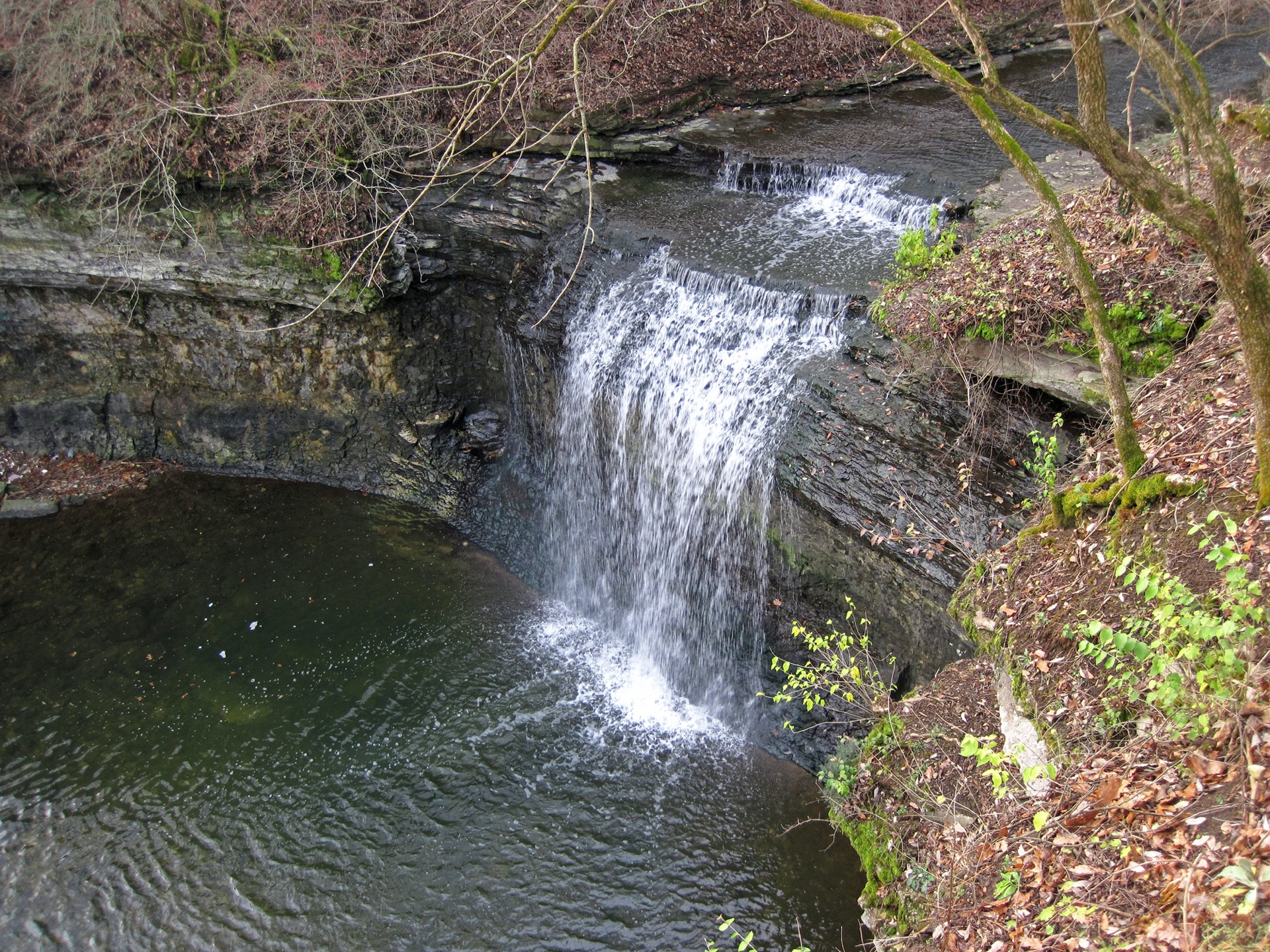 Millikin Falls pouring into its plunge pool at Quarry Trails Metro Park in Columbus