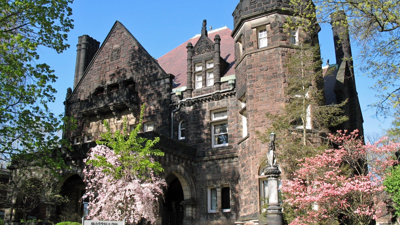 Ohio’s Gilded Age: 9 Mansions and Estates You Can Actually Tour 5 five oaks stone mansion massillon womans club with turret and spring blossoms