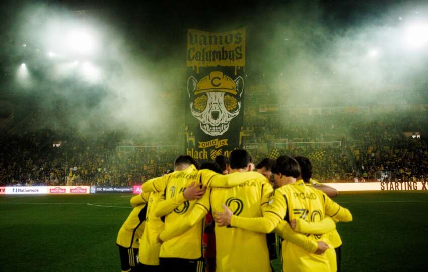 columbus crew teammates in huddle
