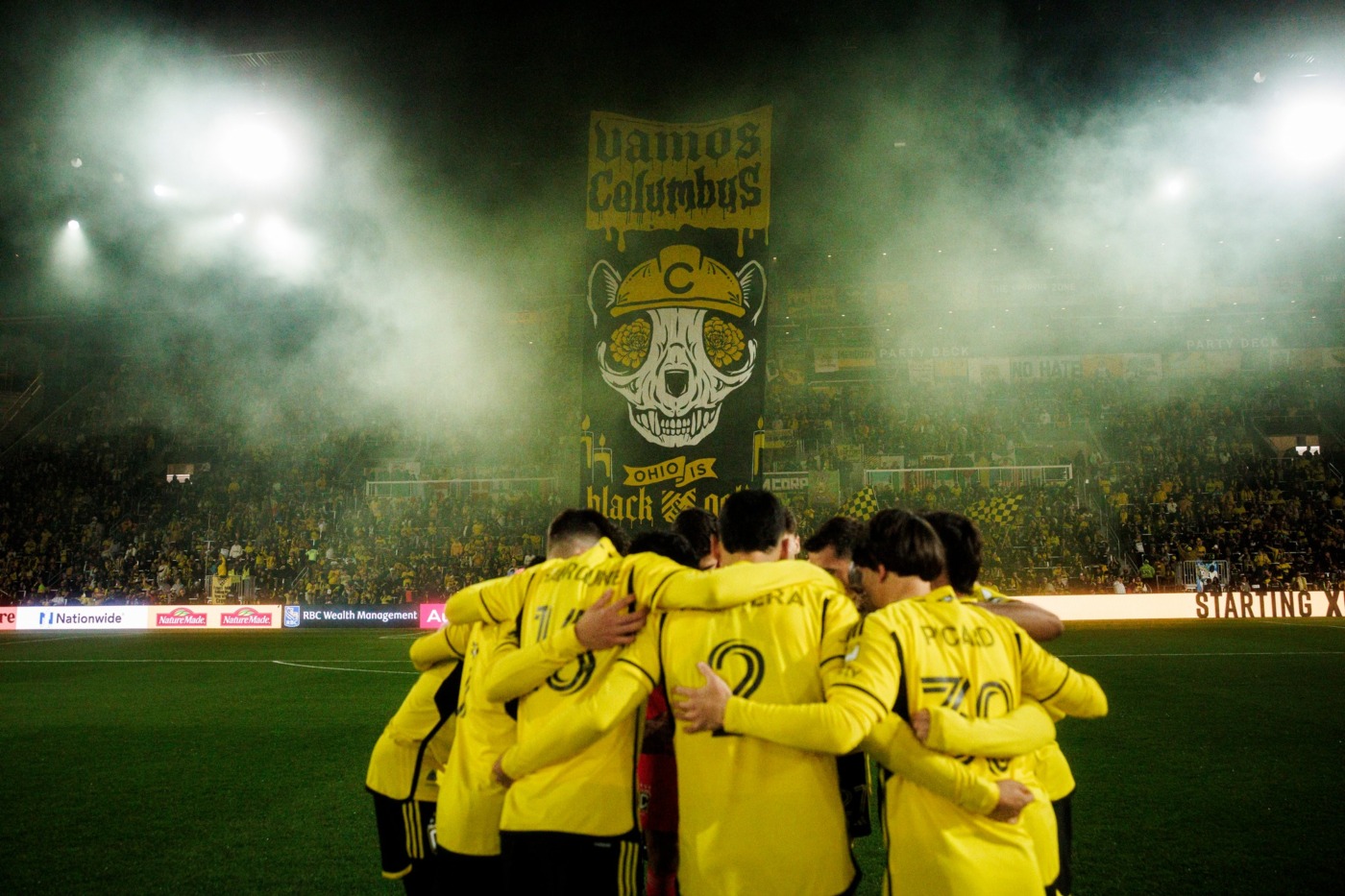 columbus crew teammates in huddle