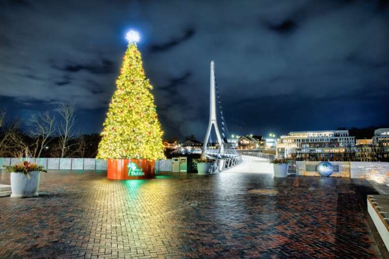 illuminated christmas tree in front of bridge in dublin ohio