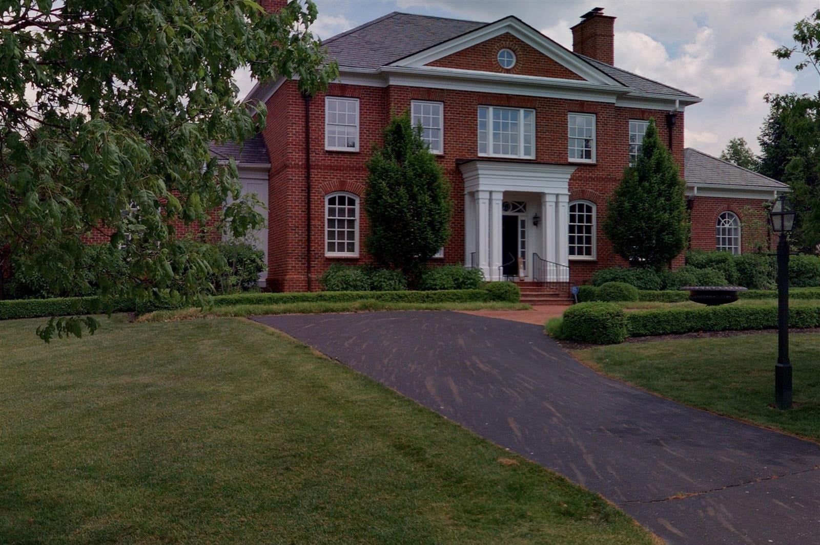 red brick georgian house with a white columned portico new albany ohio