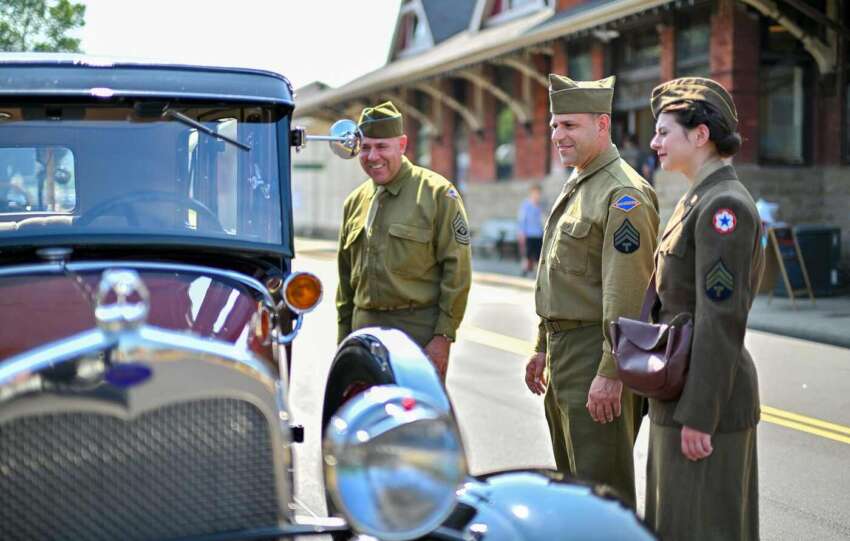 people looking at old car