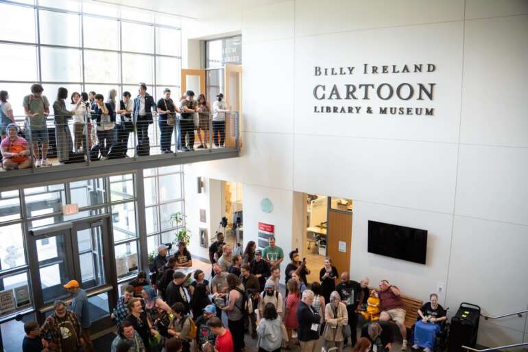 Billy Ireland Cartoon Library Reopening Brings Rare Comics Exhibit To Columbus 5 Visitors gather inside Billy Ireland Cartoon Library & Museum atrium with crowds on multiple levels.