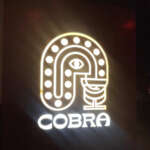 glowing sign at cobra bar