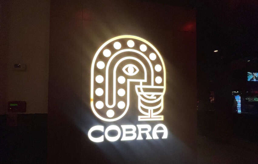 glowing sign at cobra bar