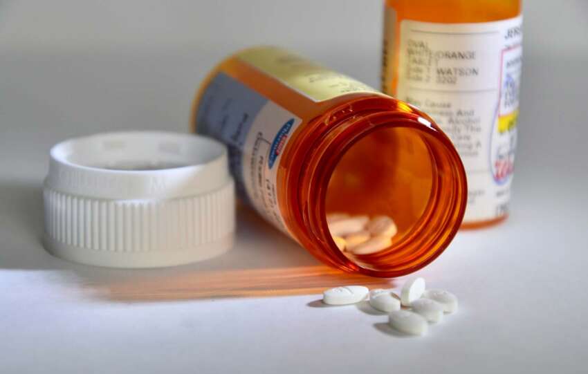 pills falling out of pill bottle