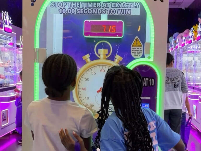 Fantasy Claw Arcade Opens At Easton This Weekend With More Than 70 Claw Machines 9 kids playing at arcade