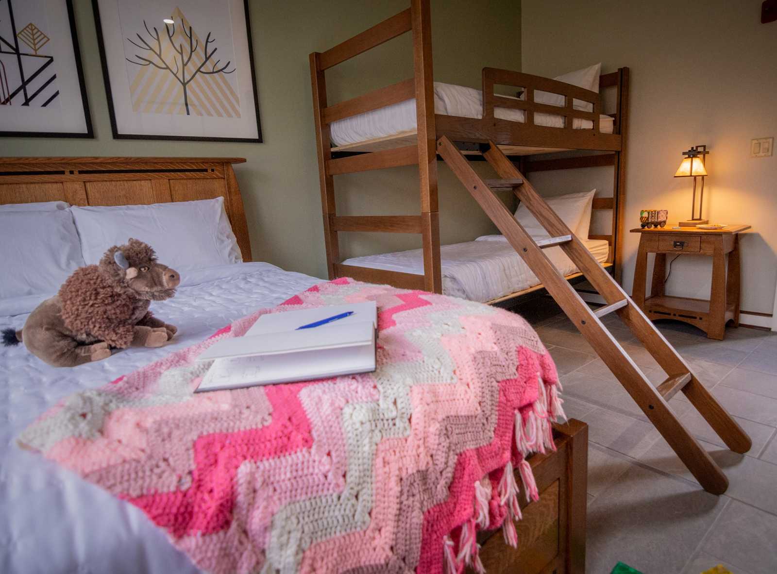 bedroom with bunk beds and queen bed
