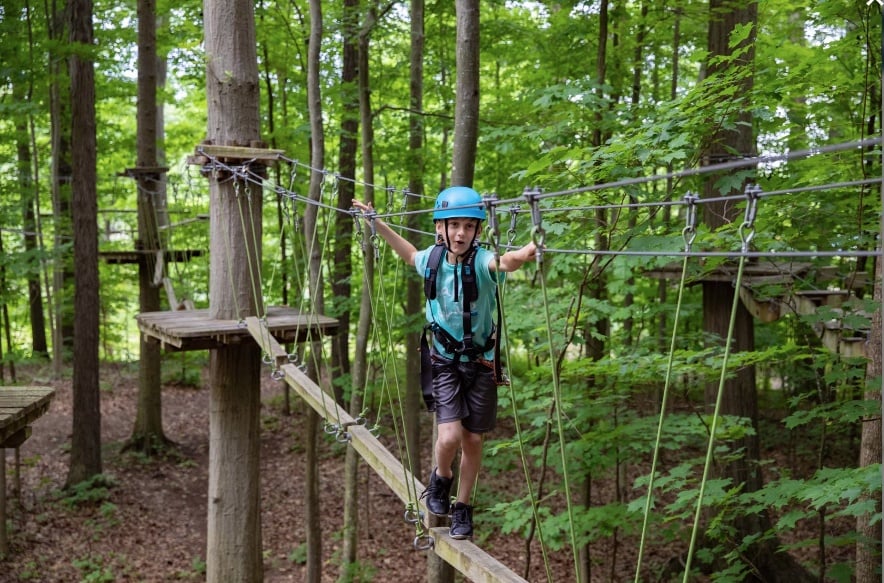 child on zip line course