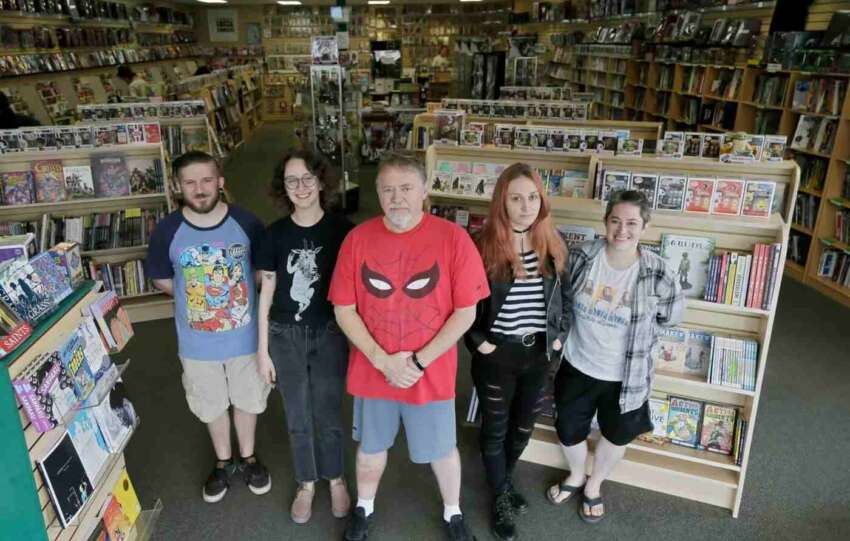 staff standing at laughing ogre comics